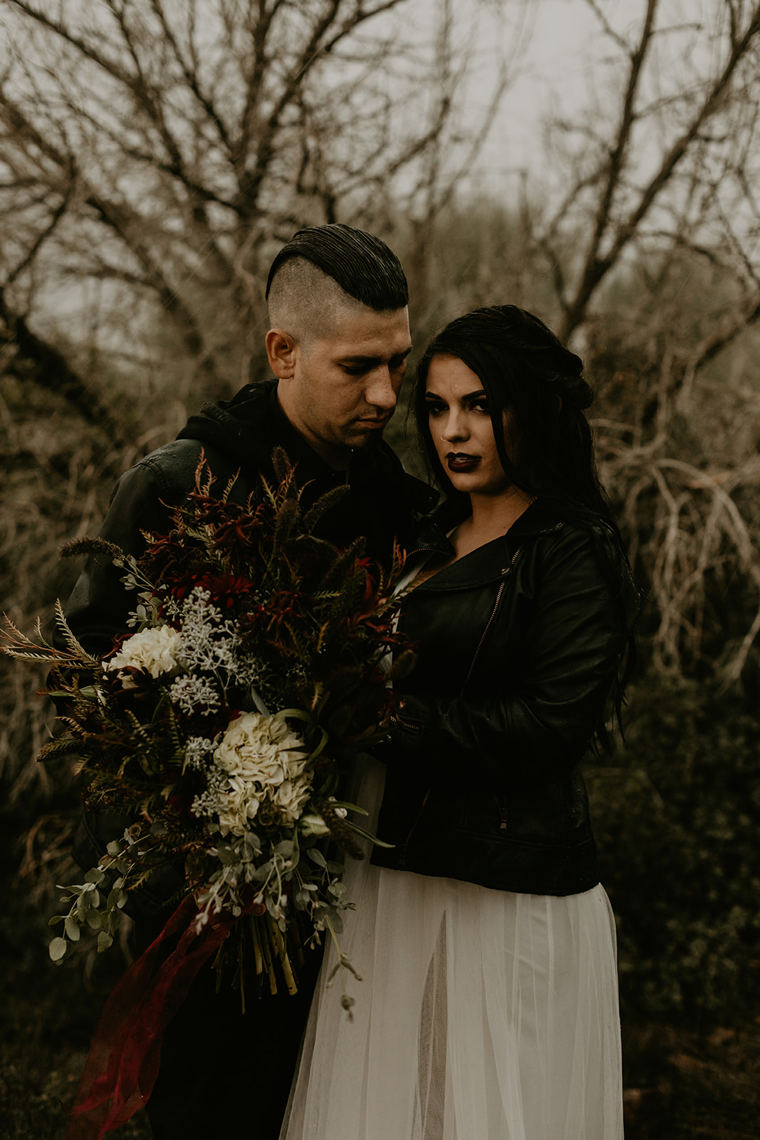 bride and groom in leather jacket