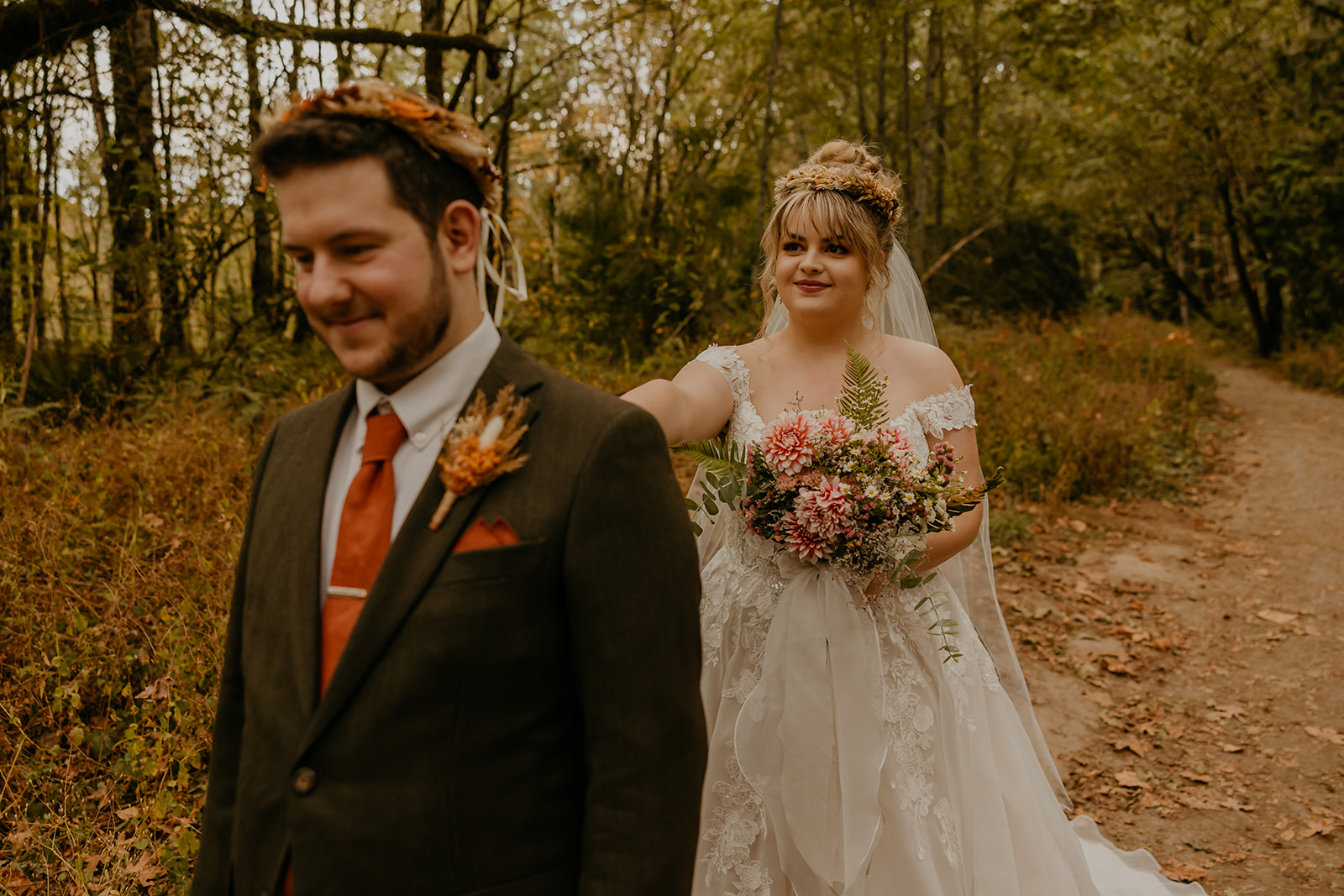 first look wedding photo in the forest