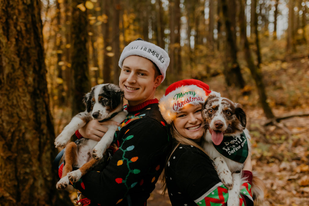 holiday photoshoot ideas, couple with christmas sweaters